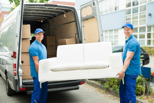 Man and van pricing explained with moving boxes and furniture