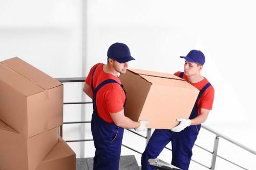 Removal team handling furniture during a Tottenham Hale house move