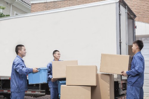 Local movers organising boxes in a Tottenham Hale property