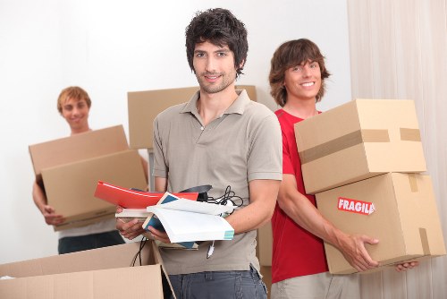 Commercial moving team handling office furniture and equipment