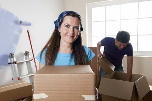 Removal crew handling bulky items with care in a local street