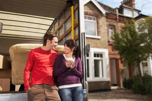 Moving crew handling a flat move near Tottenham Hale with careful access planning